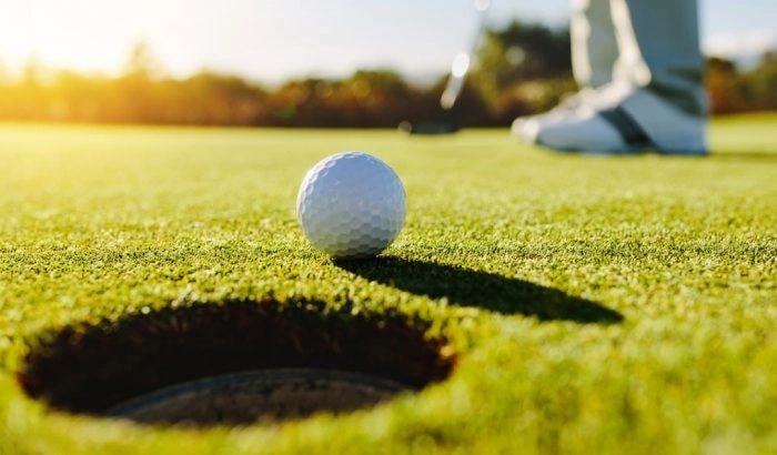 Golf ball on putting green
